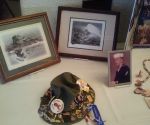 pictures and a hat with a pin collection found in Uncle Mike\'s house